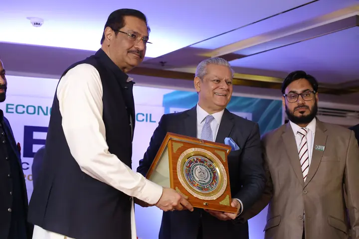 PAC Leadership presenting PAC souvenir shield to Honorable Guest.
